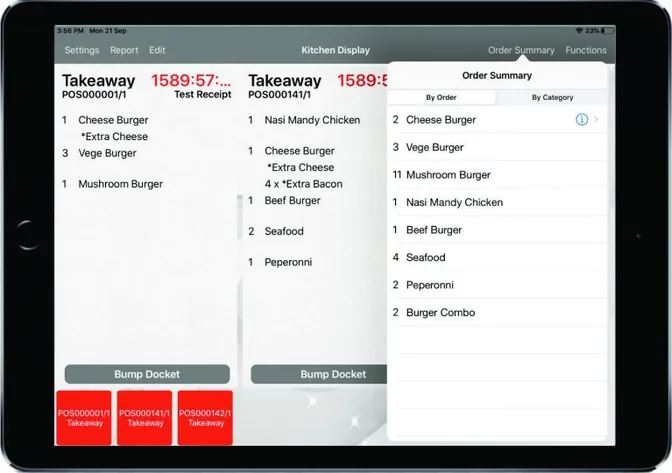 The kitchen display on an iPad: two takeaway dockets with their item modifiers, beside an order summary panel.